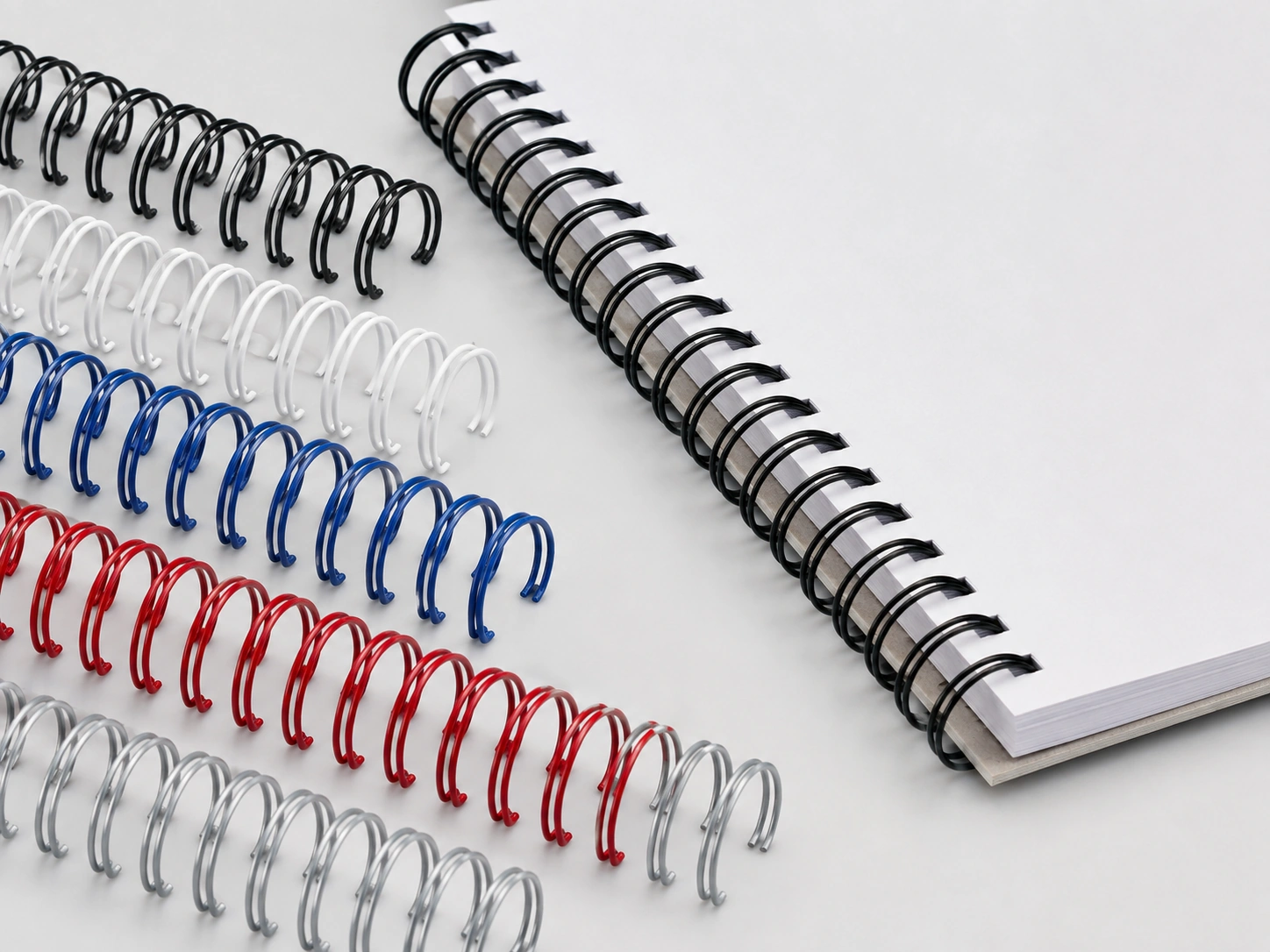Custom colored nylon coated wire o binding supplies demonstrating smooth surface finish and bend integrity after closing Custom colored nylon coated wire o binding supplies demonstrating smooth surface finish and bend integrity after closing
